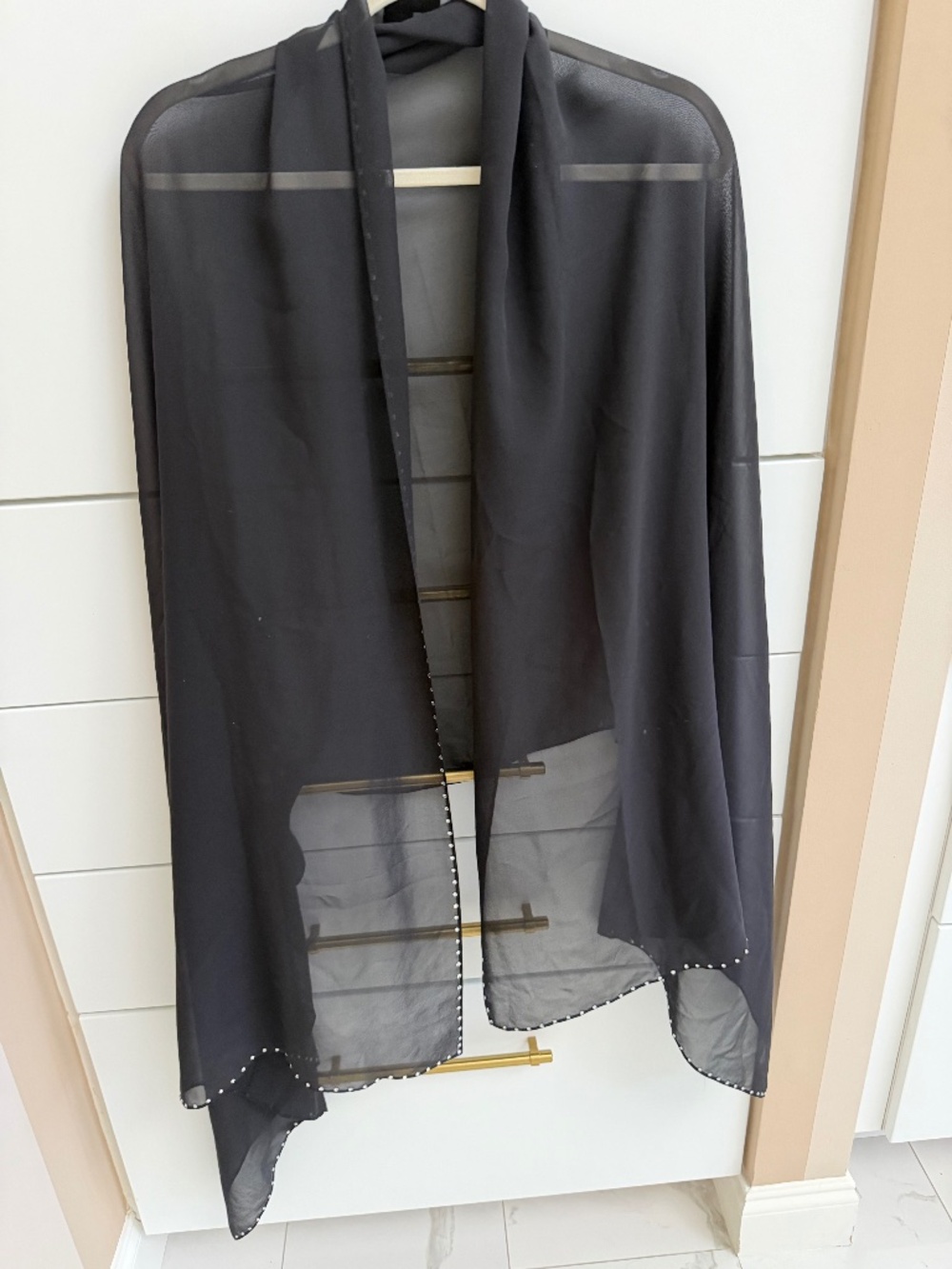 St. John’s silk wrap edged with rhinestones around